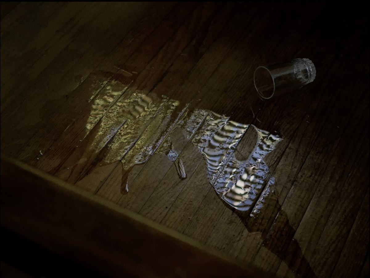 Frame from #nothinglastsforever: light on a wooden floor
